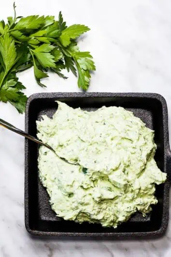 Keto Green Goddess Dip in a black cast iron dish.