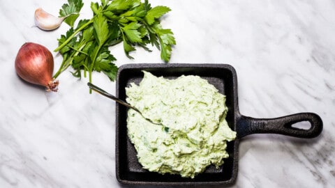 Keto Green Goddess Dip in a black cast iron dish.