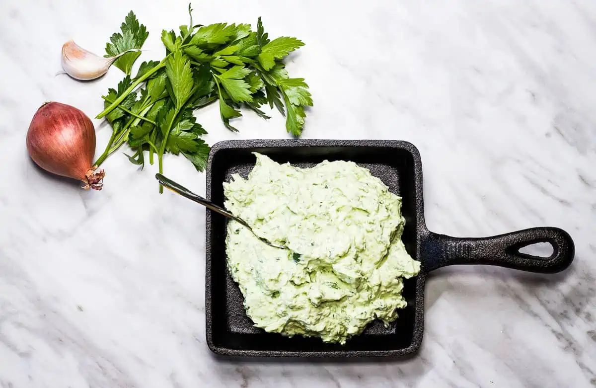 Keto Green Goddess Dip in a black cast iron dish.