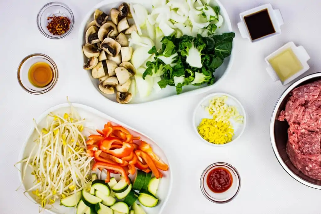 all the prepped veggies and ingredients to make spicy keto pork stir fry recipe.