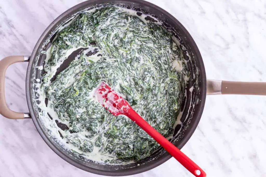 creamed spinach in pan before baking