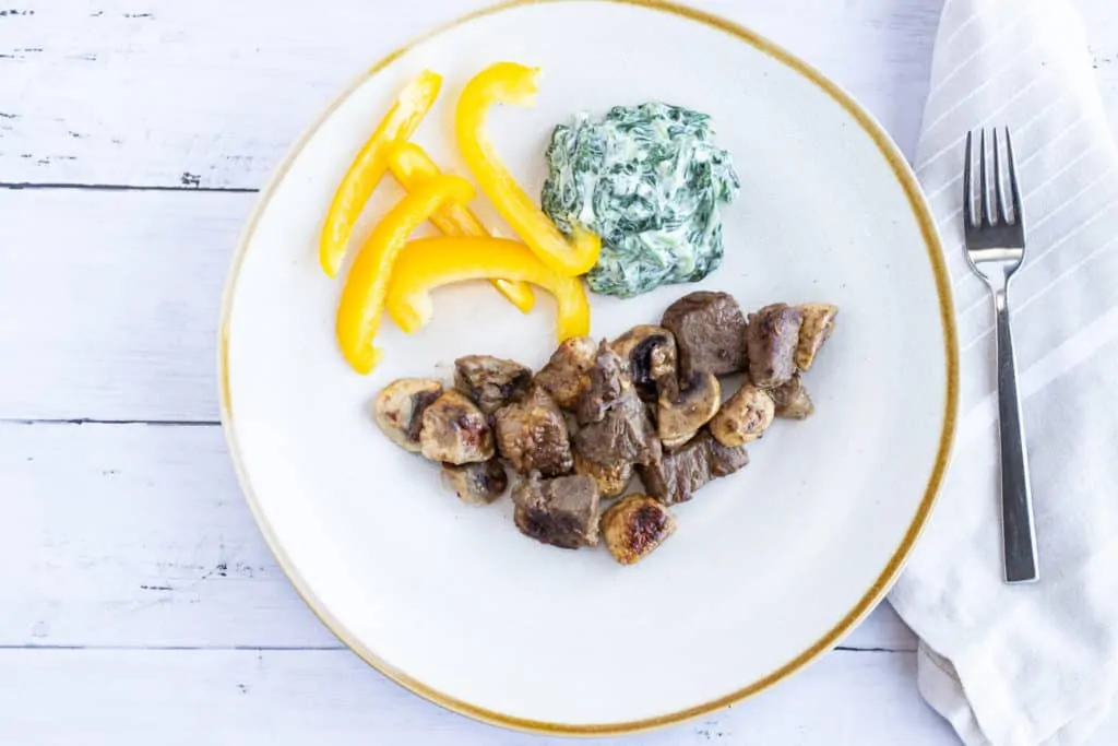 low carb and keto garlic steak and mushrooms with creamed spinach.