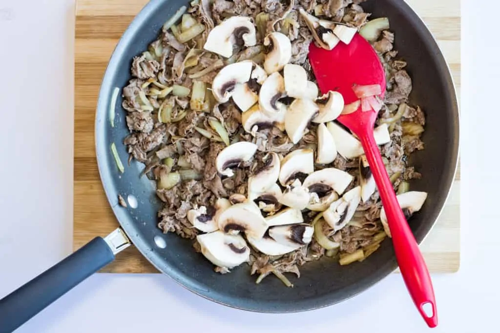 cooked onions, beef, and mushrooms