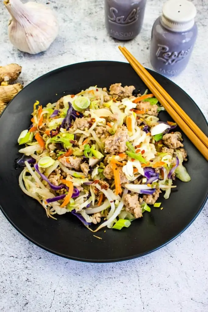 keto egg roll in a bowl on a black plate