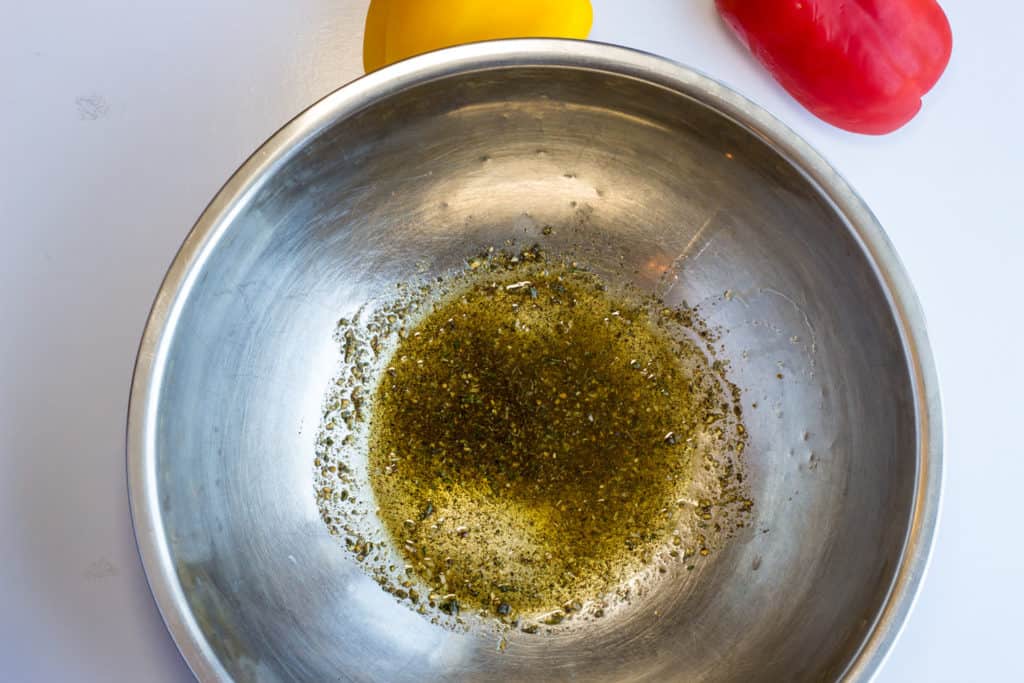 Mix the oil, garlic, and herbs.