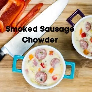 keto Smoked sausage chowder in two bowls with a knife nearby
