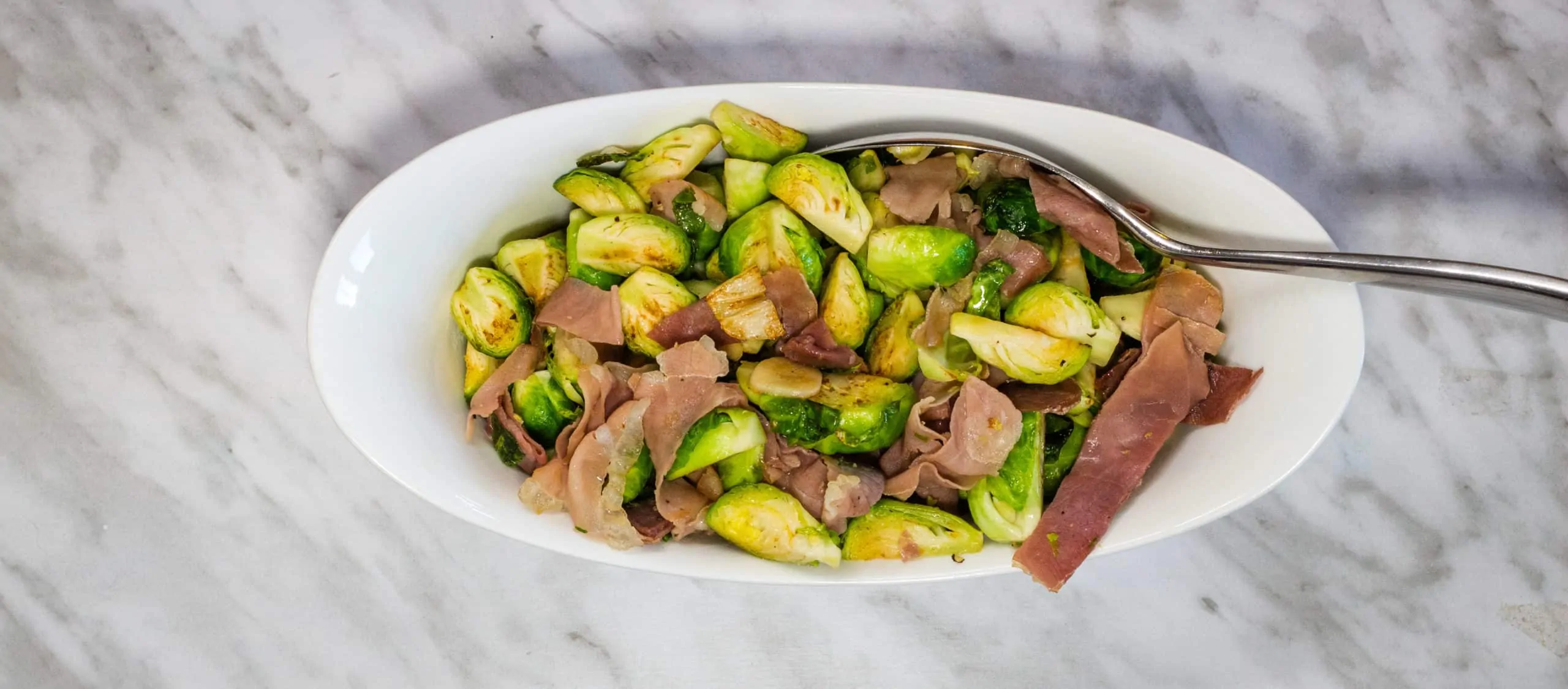 Brussels Sprouts with Prosciutto in a serving bowl