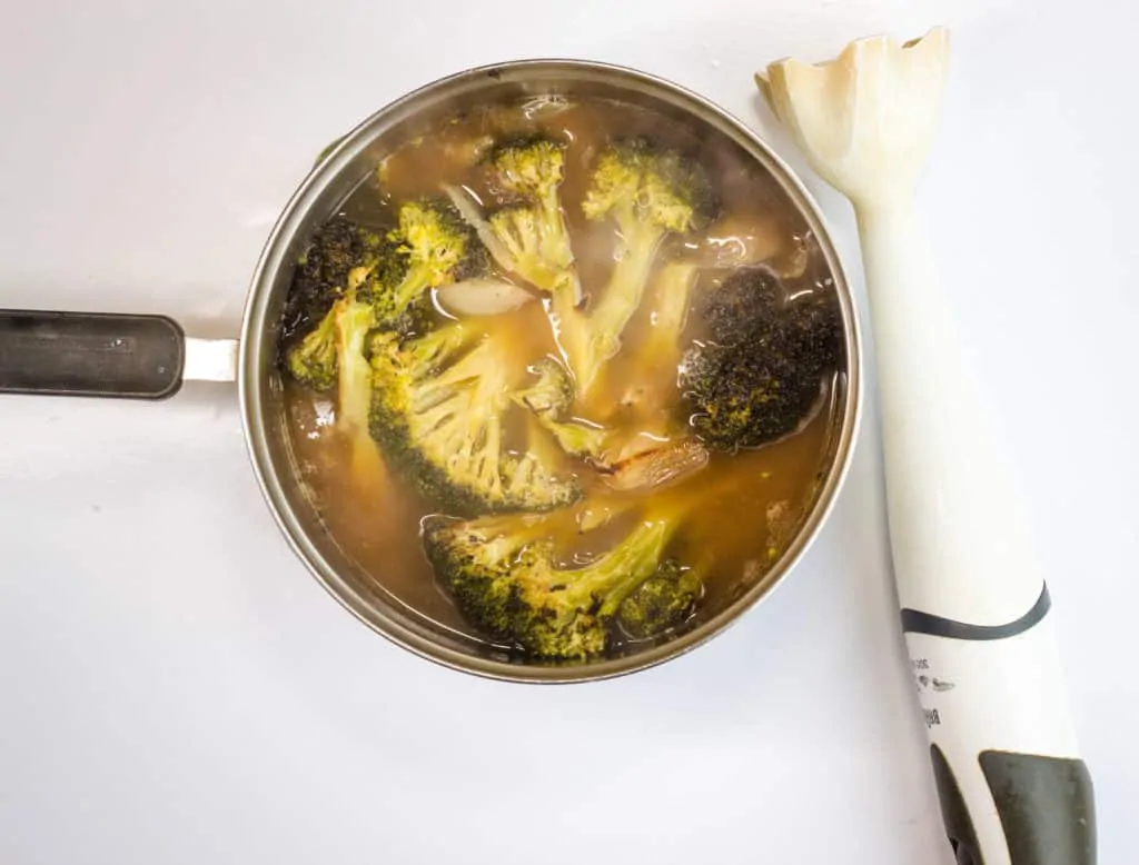 Broccoli, shallots, garlic, and broth simmered and ready for pureeing with immersion blender