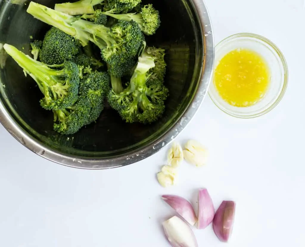 Cleaned and cut broccoli, smashed garlic, and cut shallot.