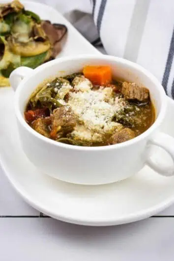 keto minestrone soup in a white soup cup