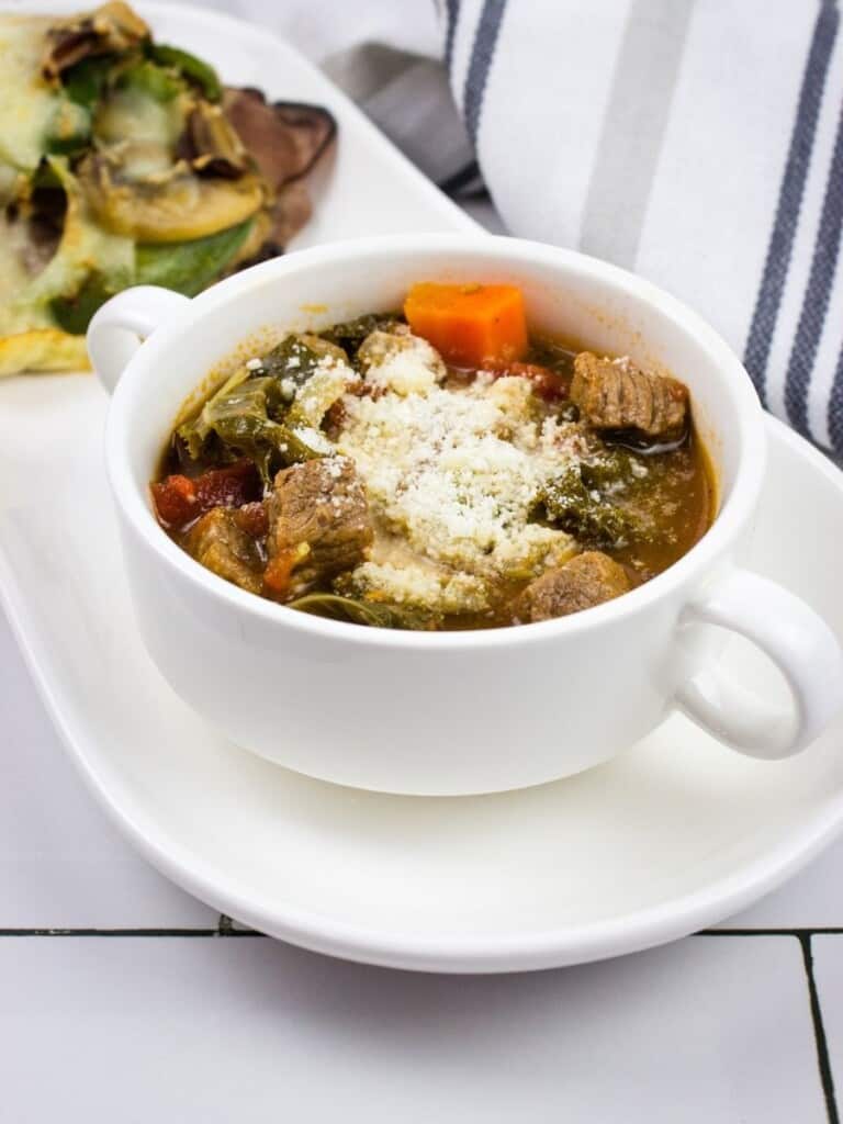 keto minestrone soup in a white soup cup