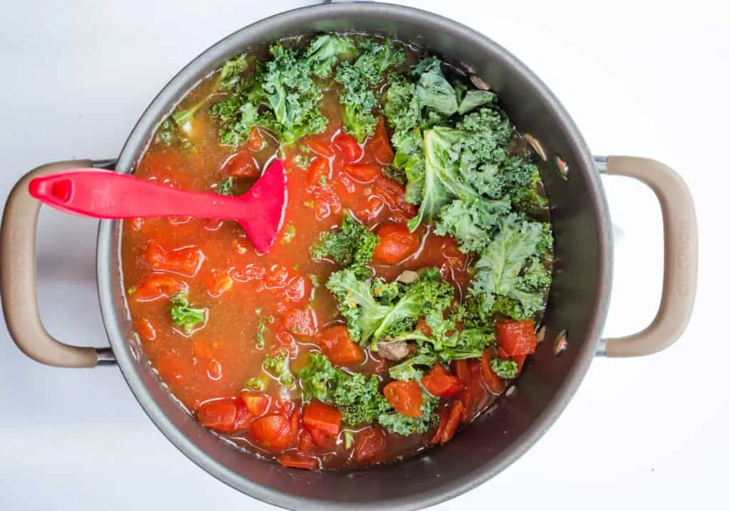 kale, tomatoes, broth, meat and onions into the pot
