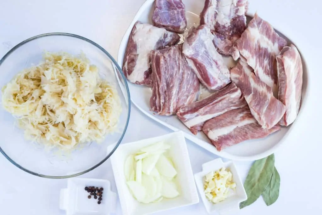 ribs, onion, garlic, sauerkraut and spices to make keto ribs and sauerkraut