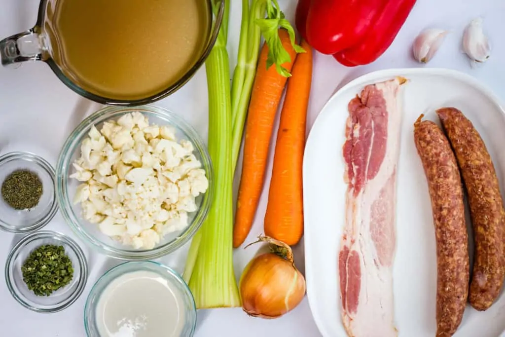 Carrots, Celery, onion, bacon, sausage, broth, cream and bell peppers for smoked sausage chowder.