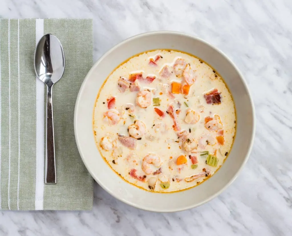 a bowl and spoon of keto shrimp and chipotle chowder