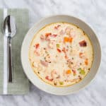 a bowl and spoon of keto shrimp and chipotle chowder