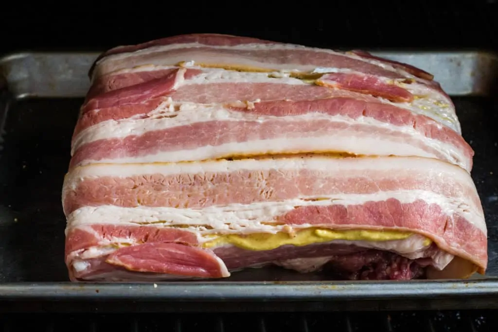 bacon-wrapped pork loin in the smoker