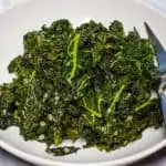 Skillet Braised Kale with Garlic in a serving dish.