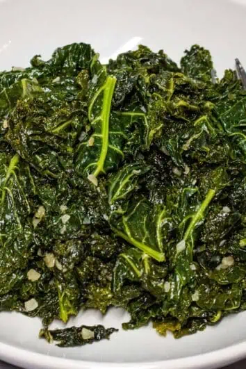 Skillet Braised Kale with Garlic in a serving dish.