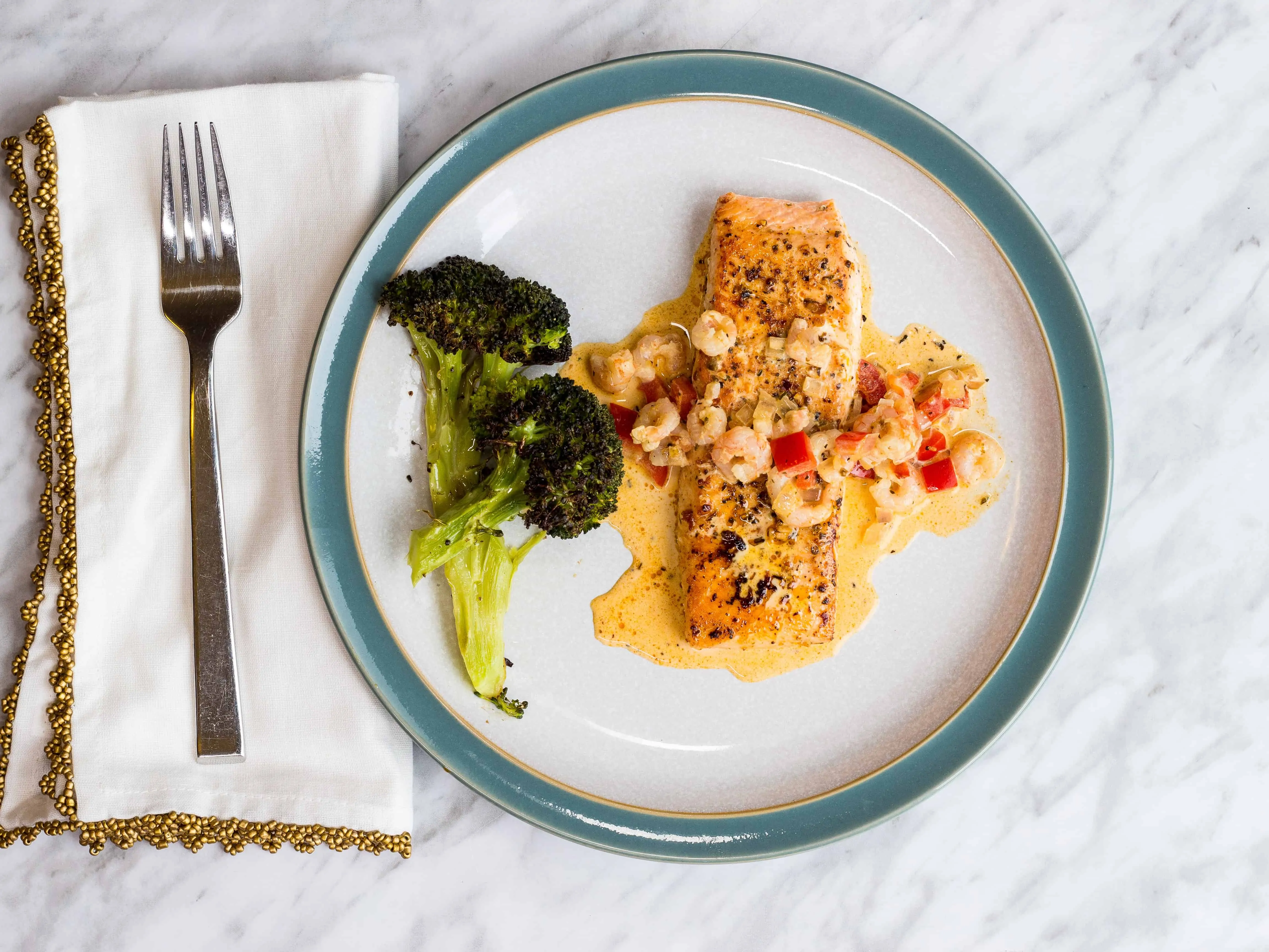 Keto cajun salmon with broccoli on a plate