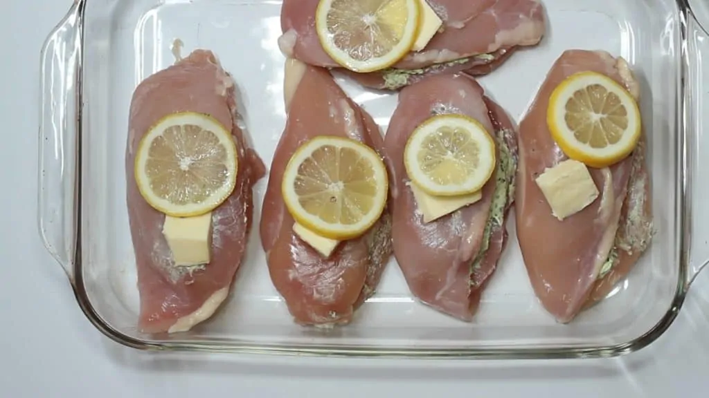 keto stuffed chicken recipe topped with butter and lemon