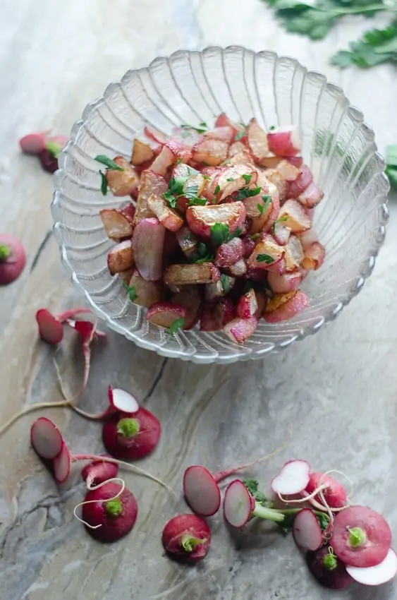 keto pan roasted radishes with parsley in a serving bowl