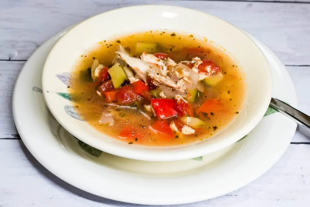 A bowlful of Mexican Turkey Soup with lime.