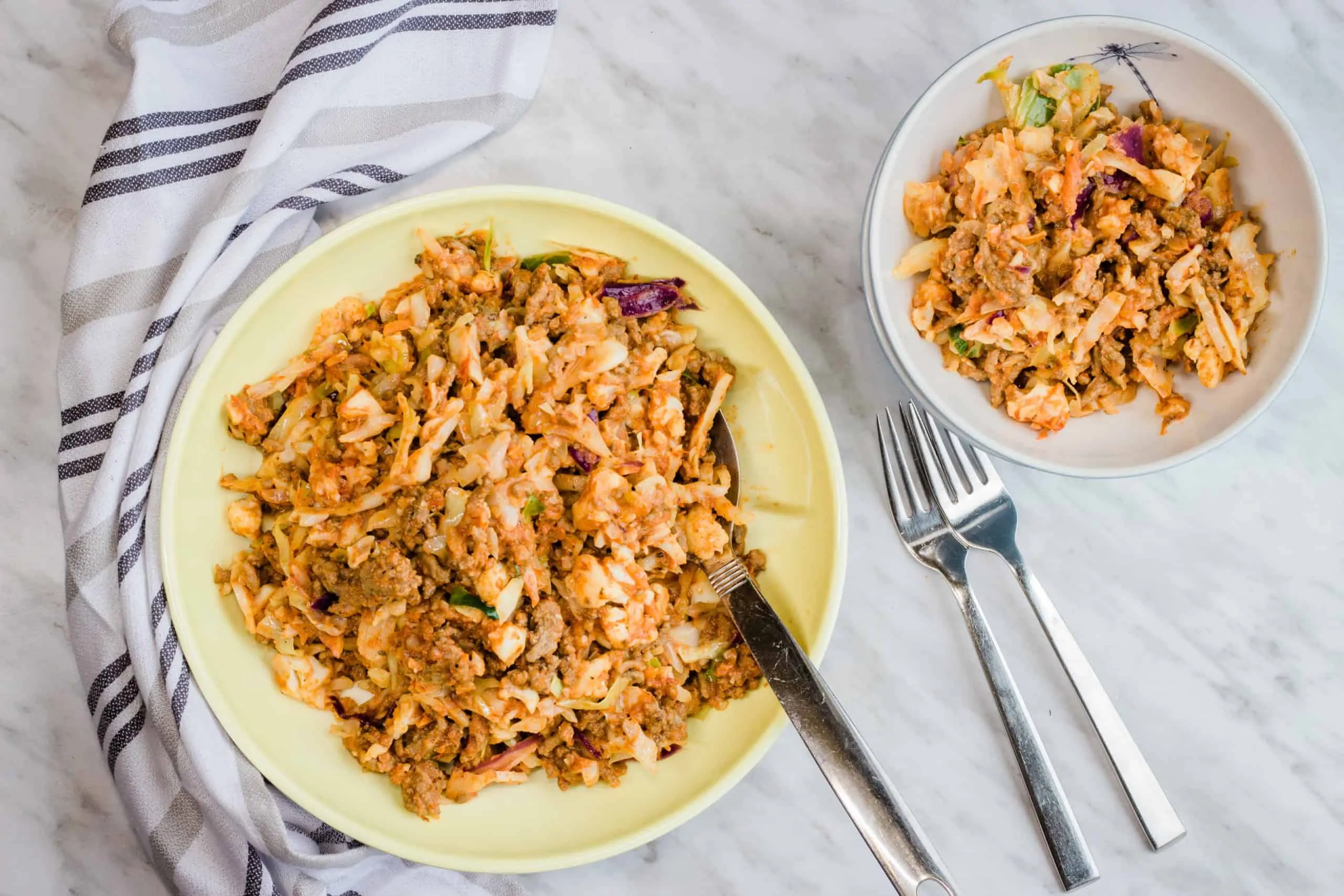 keto cabbage roll in a bowl in a serving bowl with forks