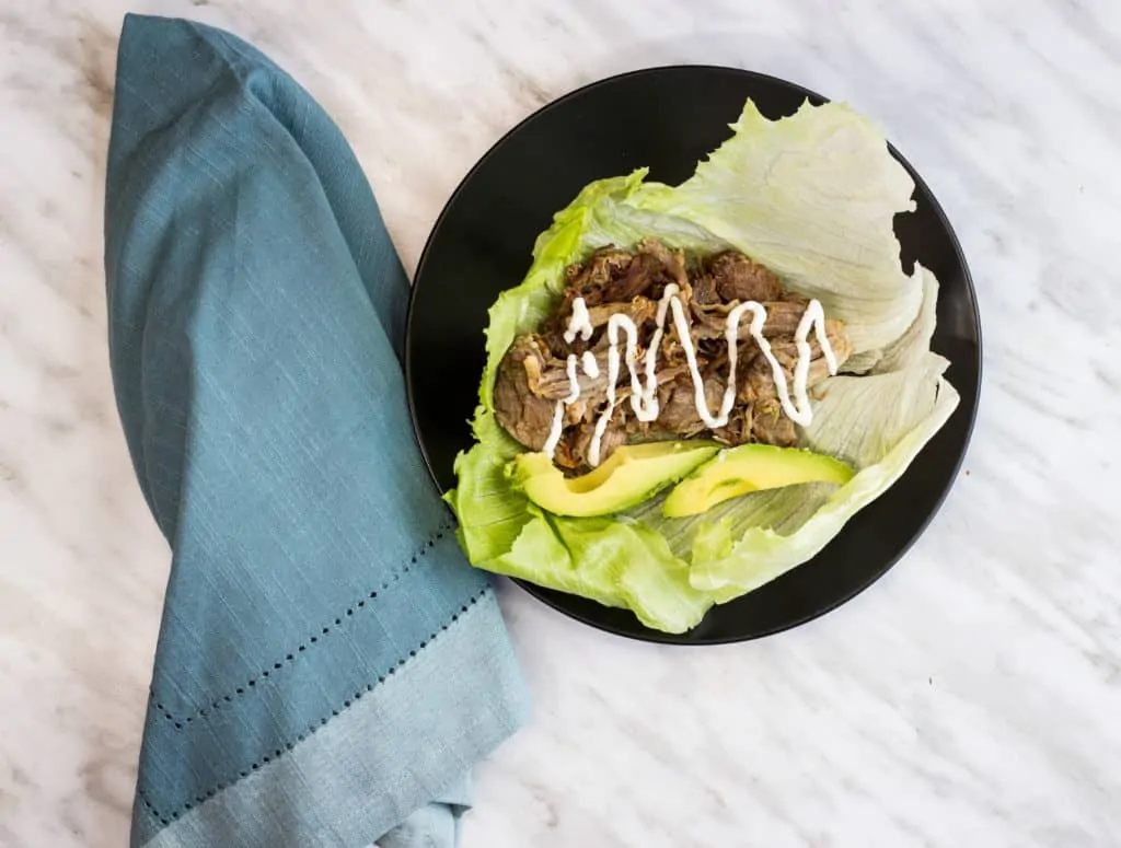 keto al pastor carnitas with avocado in a lettuce wrap