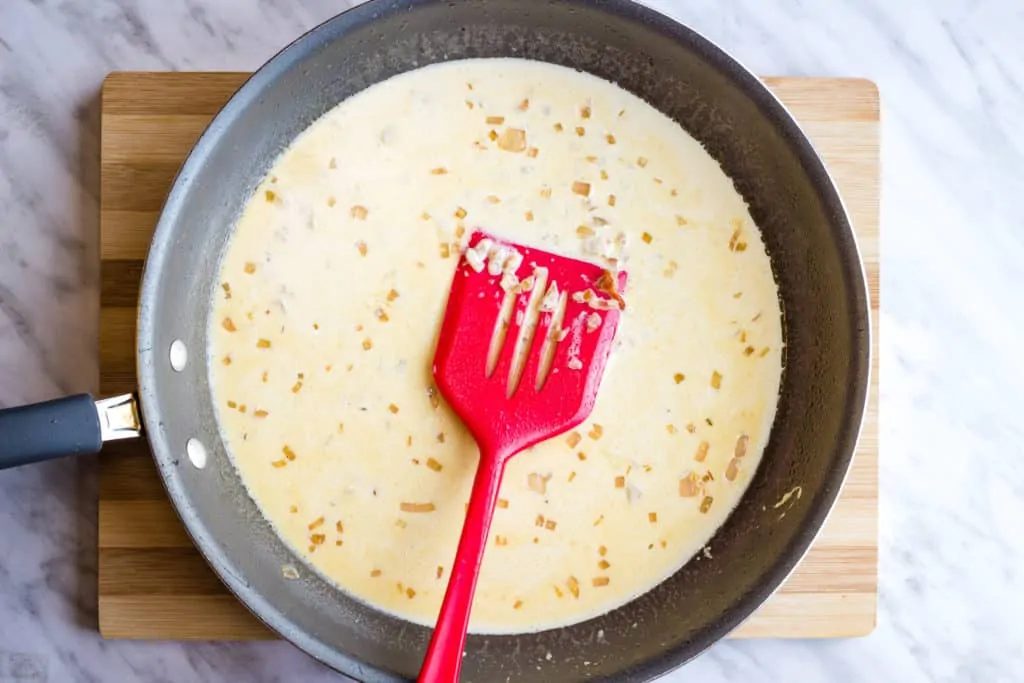 Making the cream sauce in a large skillet