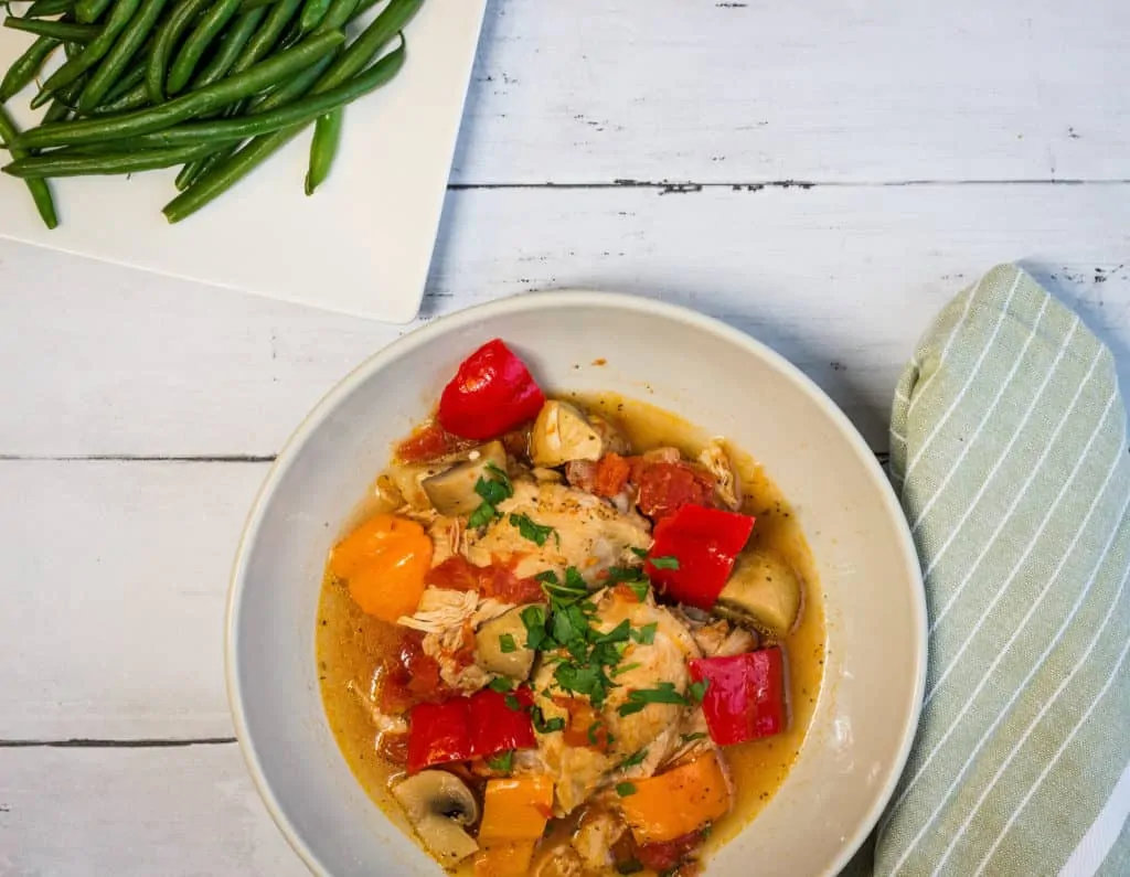 keto chicken cacciatore plated with a side of beans