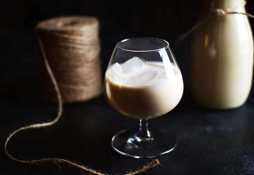 Irish cream liqueur in a snifter glass with ice.