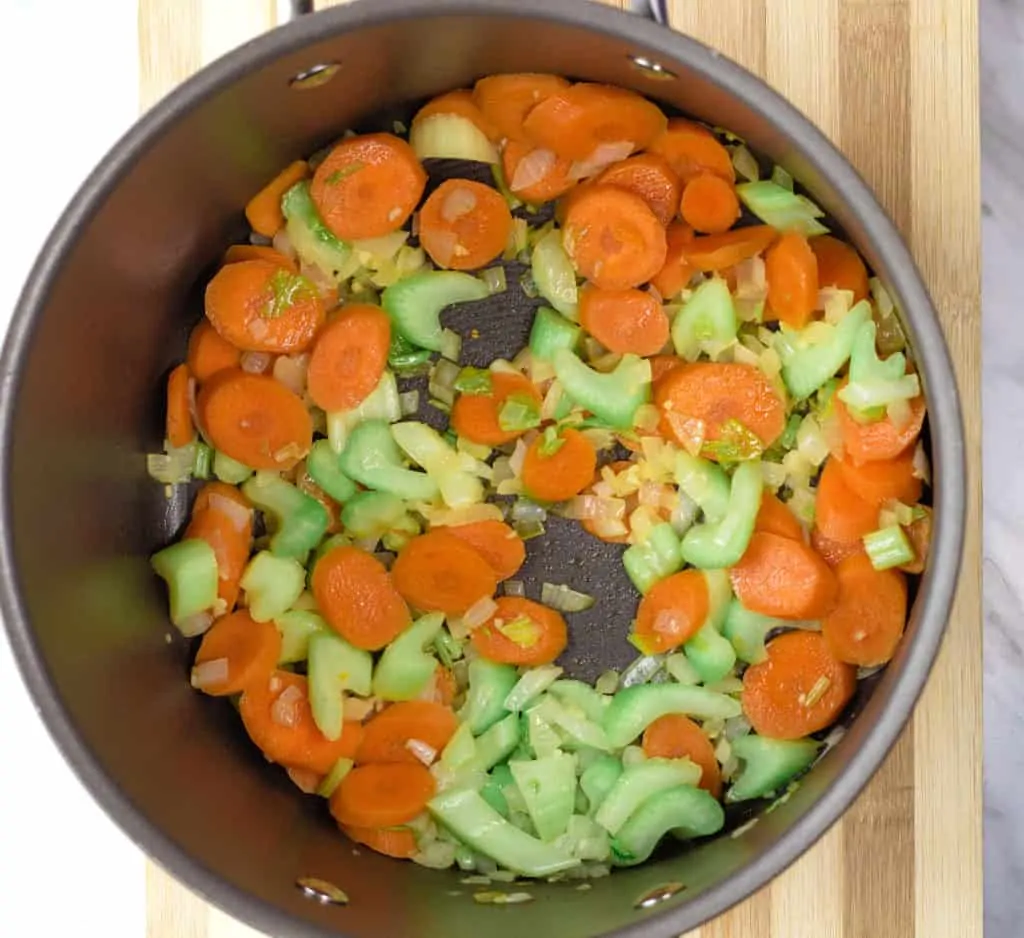 carrot, celery, onion and garlic sauteeing in a pan