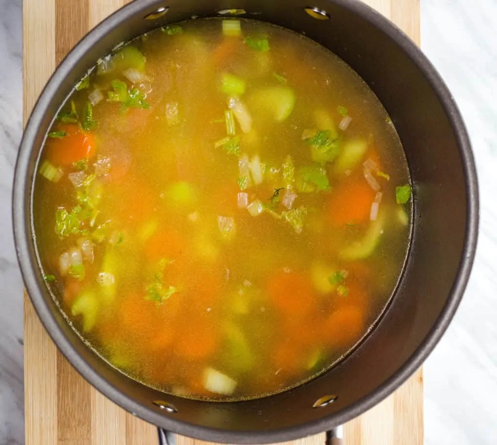 add chicken stock and simmer