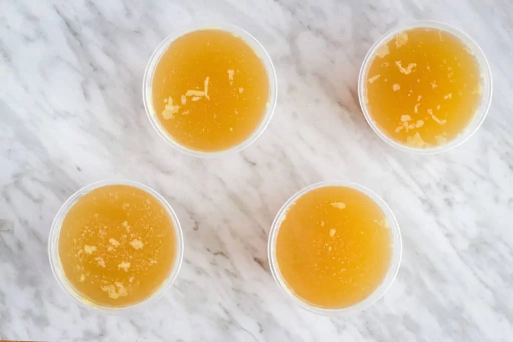 chicken bone broth in containers ready for freezing