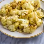 crack cauliflower on a serving dish