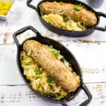 Instant pot sauerkraut & Sausage in black oval serving dishes