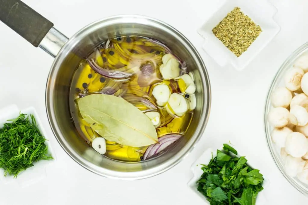 warm the oil in a pan and cook the onion, garlic and bay leaf