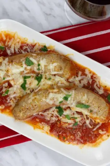 Sausage Parmigiana on a white plate