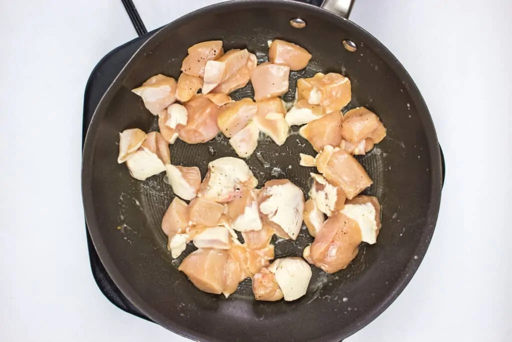 frying the chicken in butter and garlic