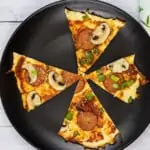 crustless pizza recipe baked and served on a black plate
