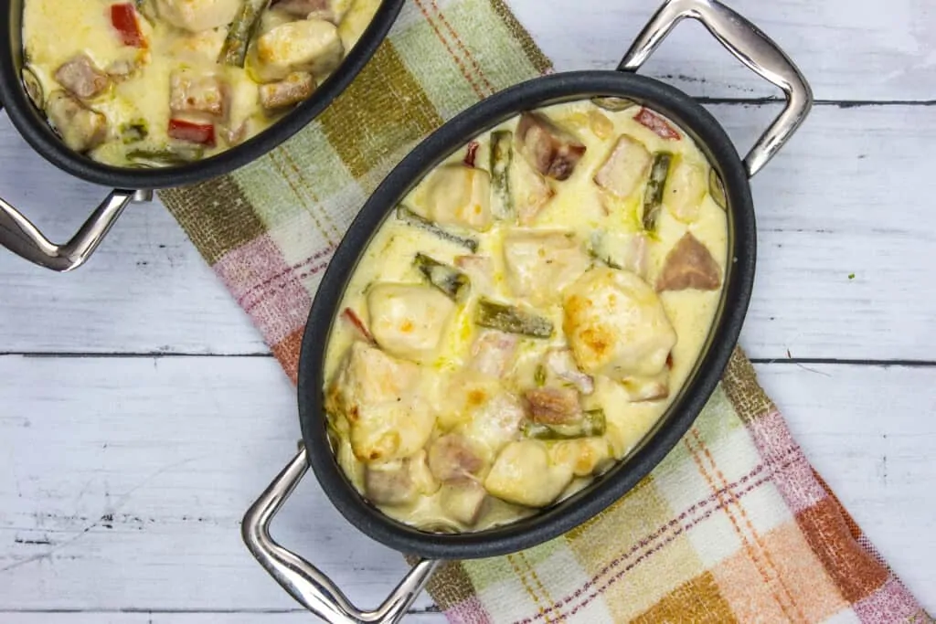 Chicken, ham and asparagus casserole in individual serving dishes