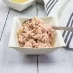 ham and pickle salad in a bowl with crackers in the background