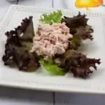 ham and pickle salad on a plate with lettuce
