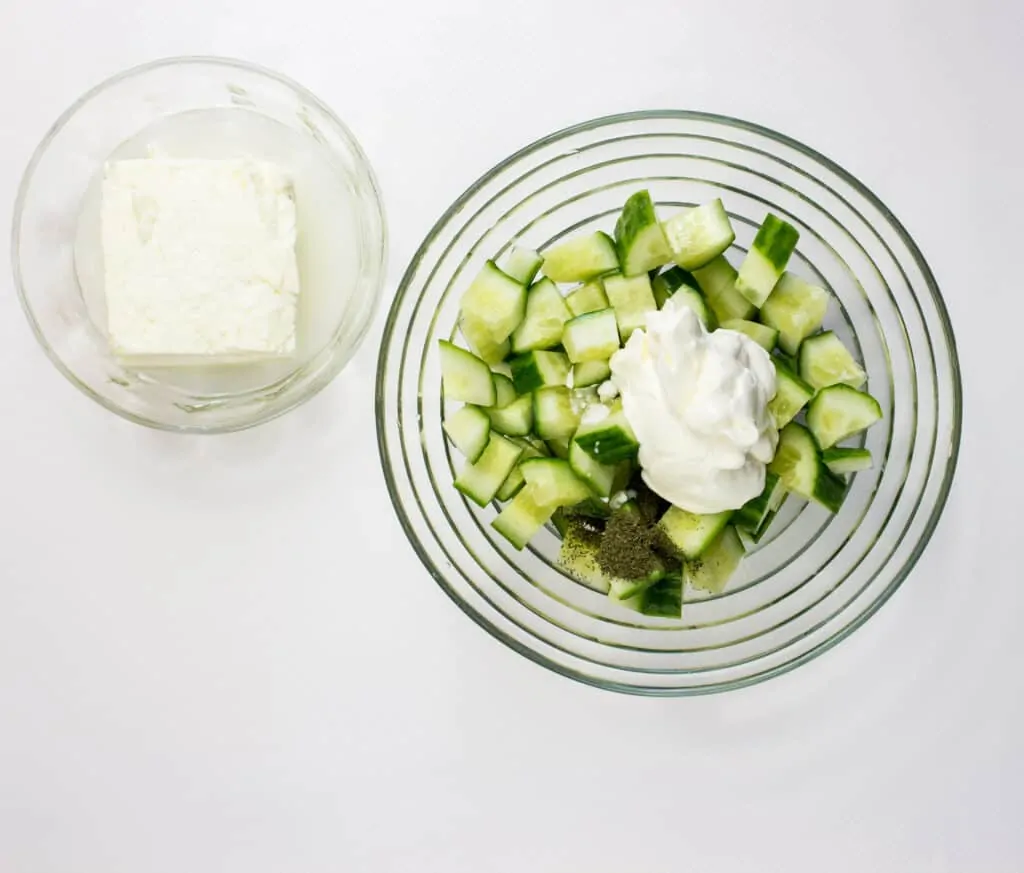 Mix the sour cream and dill with the cucumberes