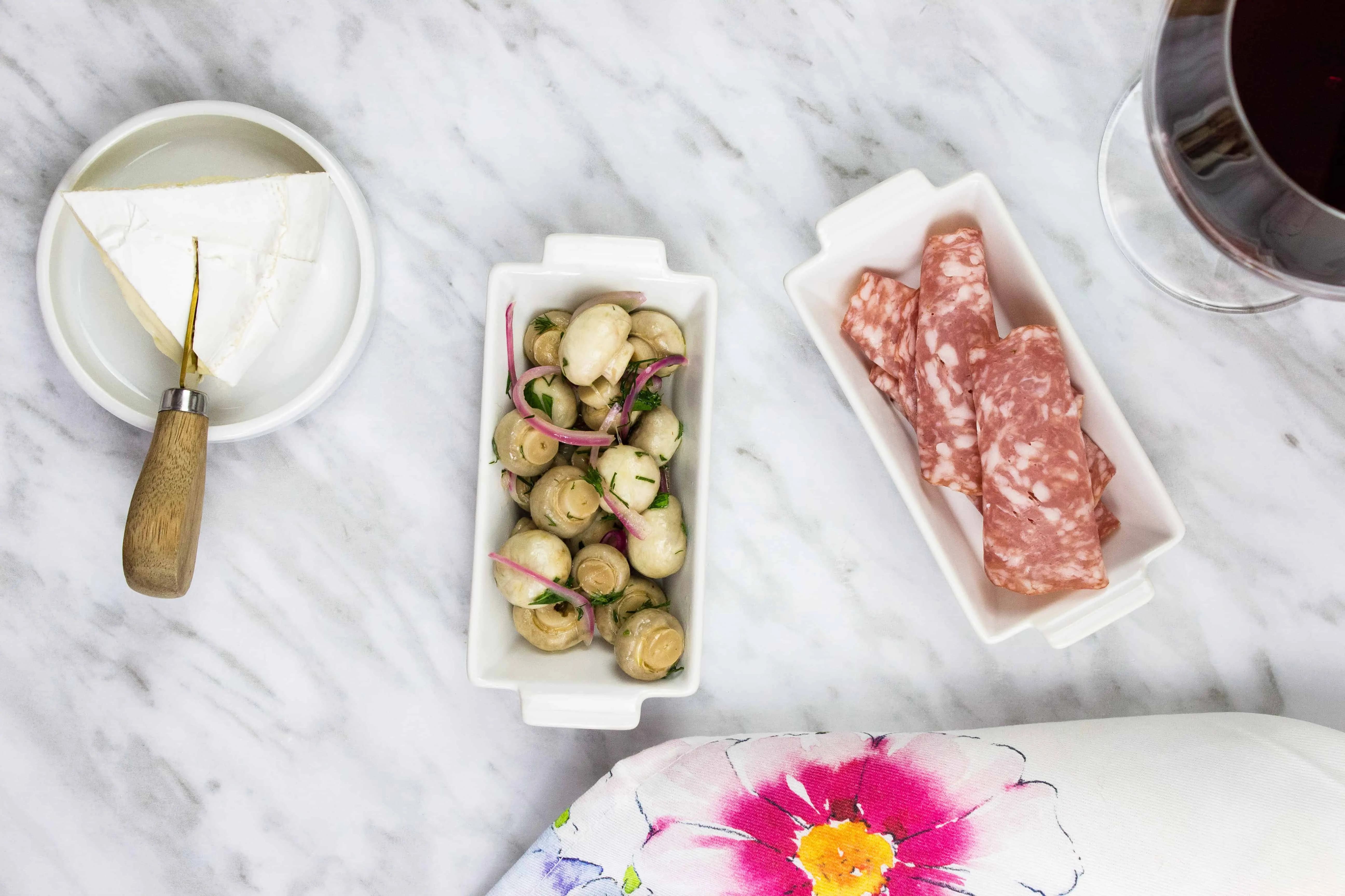 Marinated Mushrooms, cheese, salami and a glass of wine.