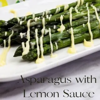 keto asparagus with lemon sauce on a plate