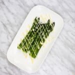 easy keto asparagus with lemon on a white plate