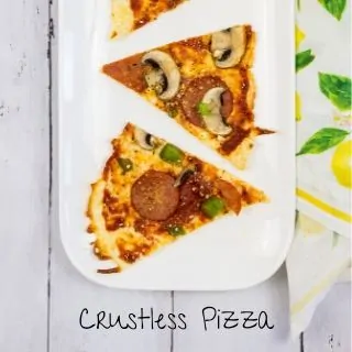 Three wedges of crustless pizza resting on a white rounded rectangular plate.