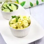 The Best Keto Egg Salad recipe on a plate with cucumbers